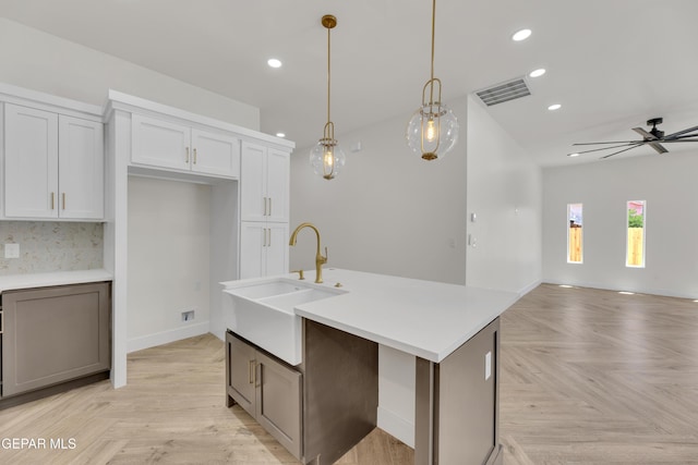 429 Lesa Ln, El Paso, TX 79915 - kitchen with a sink, recessed lighting, open floor plan, ceiling fan, and hanging light fixtures