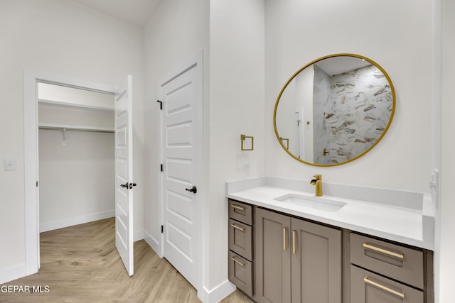 429 Lesa Ln, El Paso, TX 79915 - full bath featuring vanity, a walk in shower, parquet flooring, and baseboards