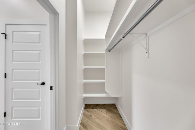 429 Lesa Ln, El Paso, TX 79915 - walk in closet with wood finished floors