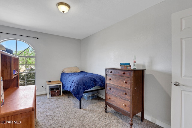 carpeted bedroom with baseboards