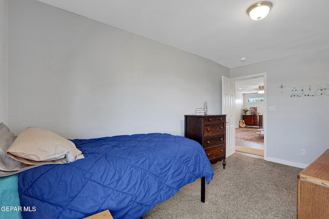 carpeted bedroom with baseboards