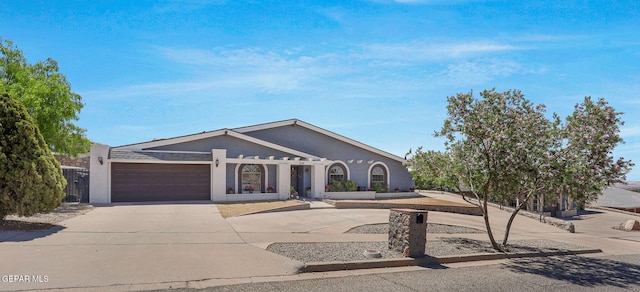 view of front of house featuring driveway and a garage