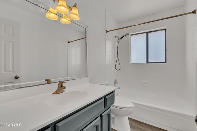 full bath with vanity, toilet, tub / shower combination, and wood finished floors