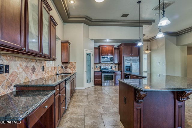 1403 Franklin Dell St, El Paso, TX 79912 - kitchen featuring appliances with stainless steel finishes, a sink, crown molding, backsplash, and hanging light fixtures