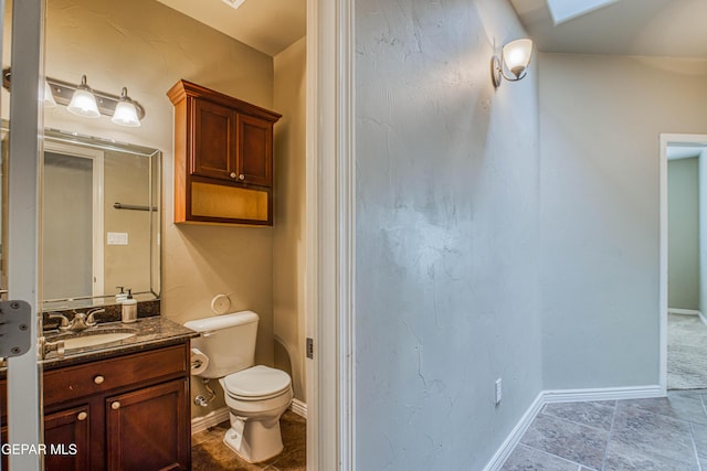 1403 Franklin Dell St, El Paso, TX 79912 - bathroom featuring toilet, vanity, and baseboards