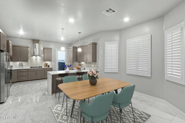12627 Naes Way, El Paso, TX 79928 - dining room featuring light marble finish flooring and baseboards