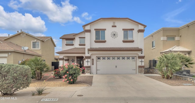 14577 Ava Leigh, El Paso, TX 79938 - view of front facade with stucco siding, an attached garage, and concrete driveway