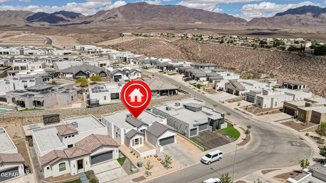 aerial perspective of suburban area featuring a mountain backdrop