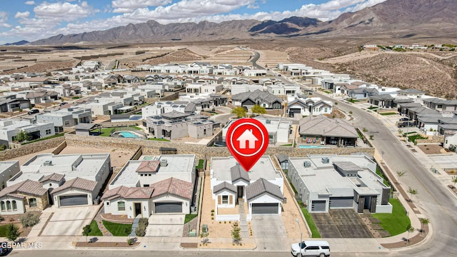aerial view of residential area featuring a mountain backdrop
