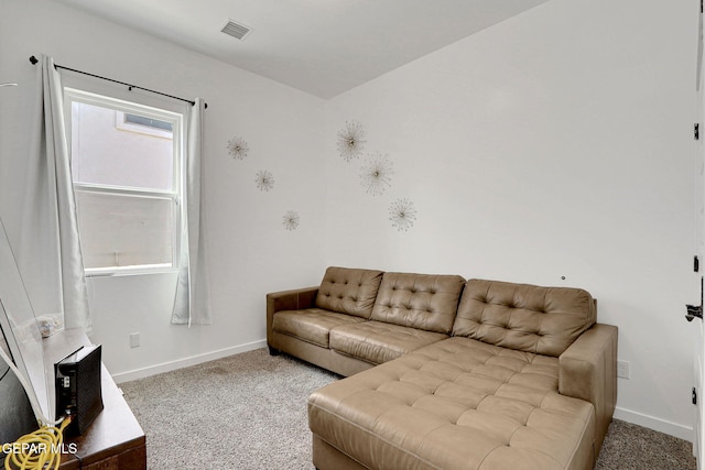 living room featuring carpet floors and baseboards