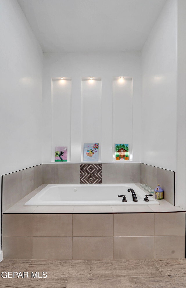 full bath with a garden tub