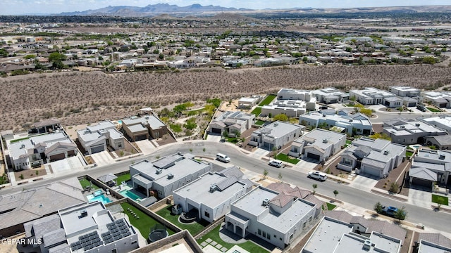 aerial view of residential area featuring mountains