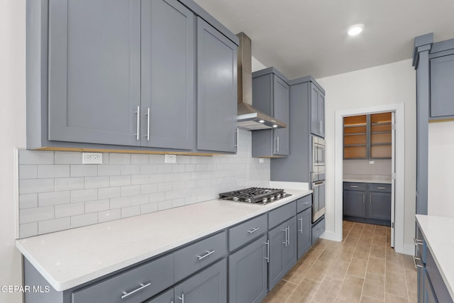 7461 Big Mountain Ct, El Paso, TX 79911 - kitchen featuring stainless steel appliances, wall chimney range hood, and light countertops