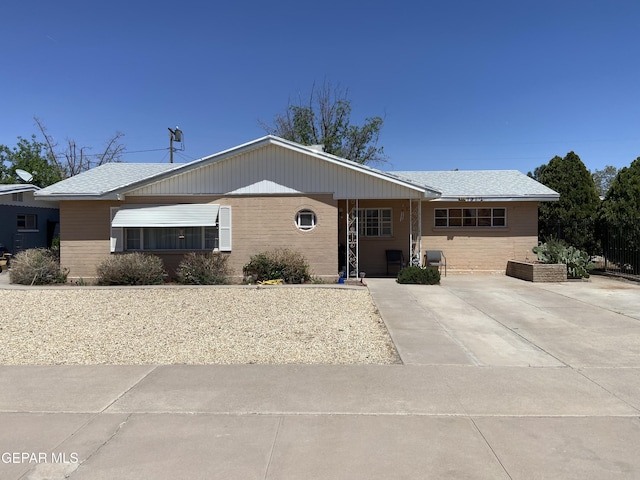 ranch-style house with brick siding