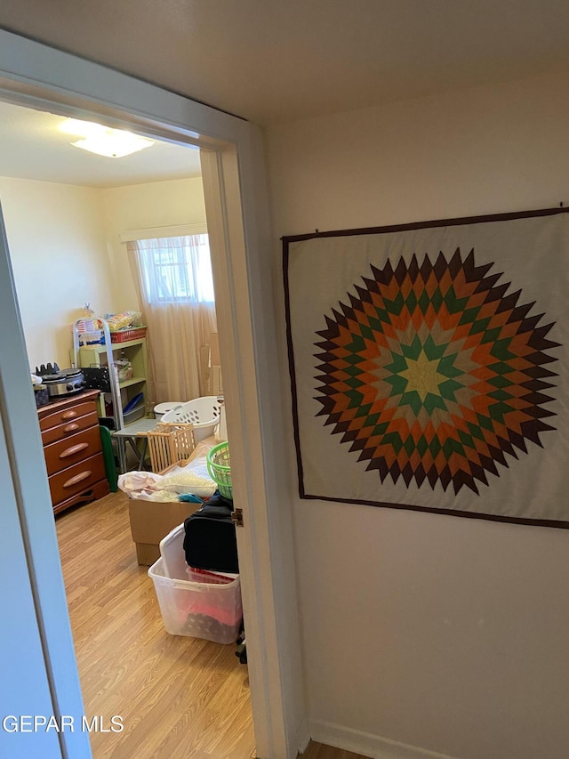 bedroom featuring light wood-style flooring