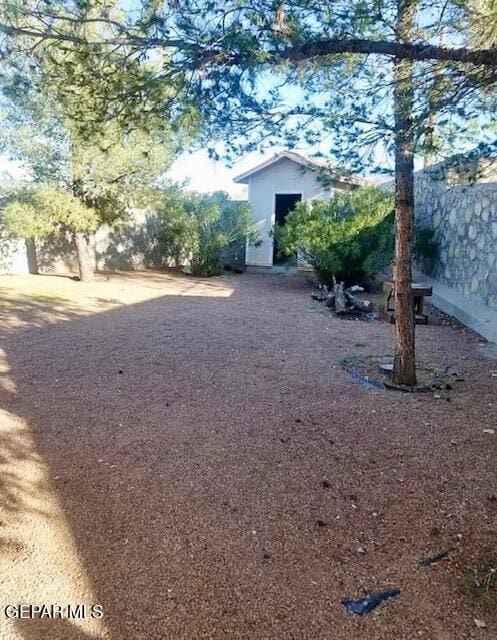 view of yard with an outbuilding and a storage shed