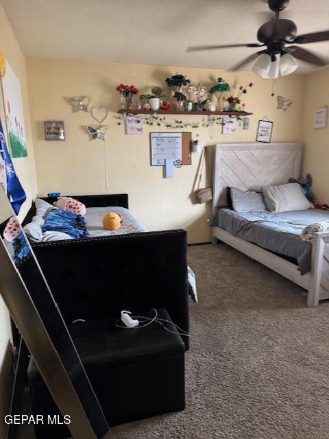 carpeted bedroom featuring ceiling fan