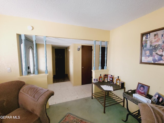 3433 Dialrock Ln, El Paso, TX 79935 - living area featuring a textured ceiling and carpet flooring