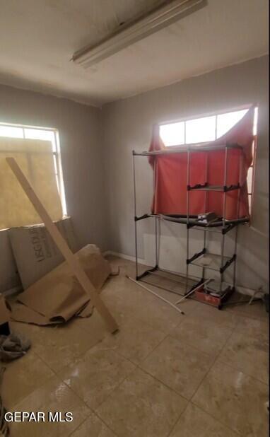3433 Dialrock Ln, El Paso, TX 79935 - bedroom featuring light tile patterned flooring