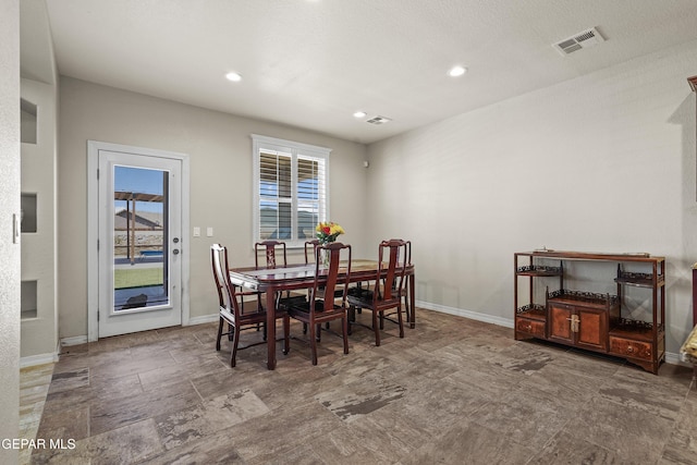 dining area with baseboards and recessed lighting