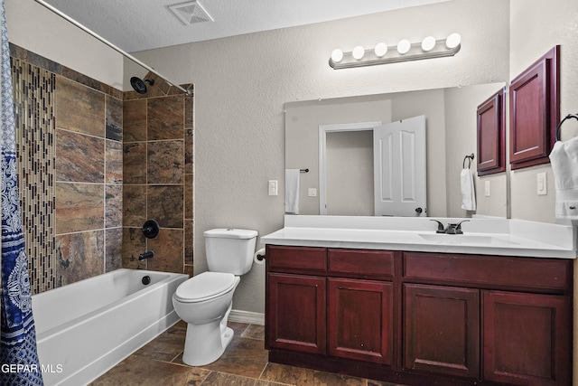 bathroom featuring toilet, tub / shower combination, vanity, baseboards, and a textured wall