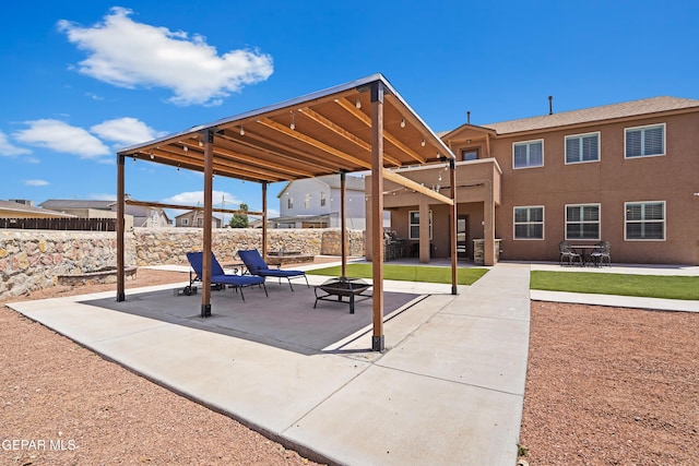 surrounding community featuring fence, a patio, and a fire pit