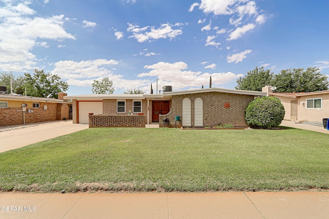 ranch-style home with a garage, concrete driveway, brick siding, and a front lawn