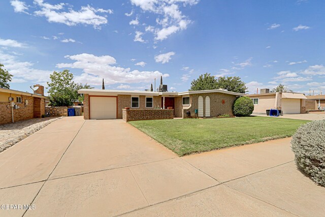 single story home with a garage, driveway, brick siding, and a front lawn