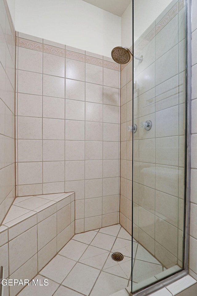 full bath with a shower stall