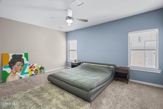 bedroom with carpet, baseboards, and ceiling fan