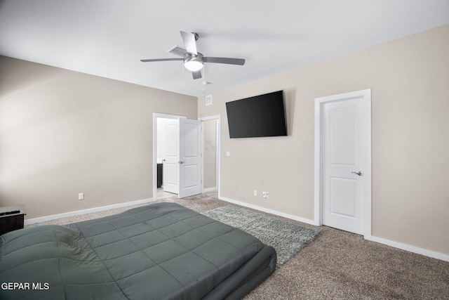 bedroom with carpet, baseboards, and a ceiling fan