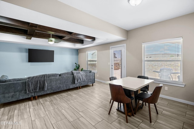 dining area with coffered ceiling, baseboards, beam ceiling, and wood tiled floors