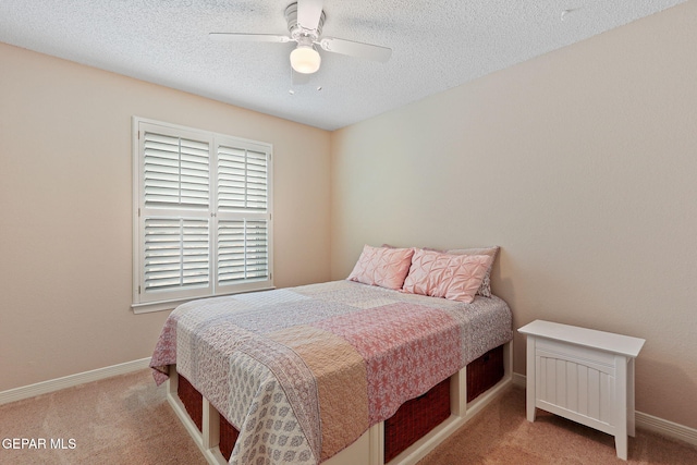 7008 Desert Canyon Dr, El Paso, TX 79912 - carpeted bedroom featuring baseboards, a textured ceiling, and ceiling fan