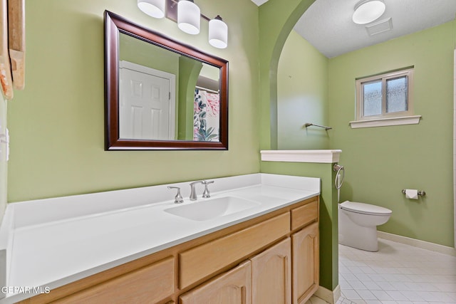 7008 Desert Canyon Dr, El Paso, TX 79912 - full bath featuring baseboards, vanity, toilet, and tile patterned flooring