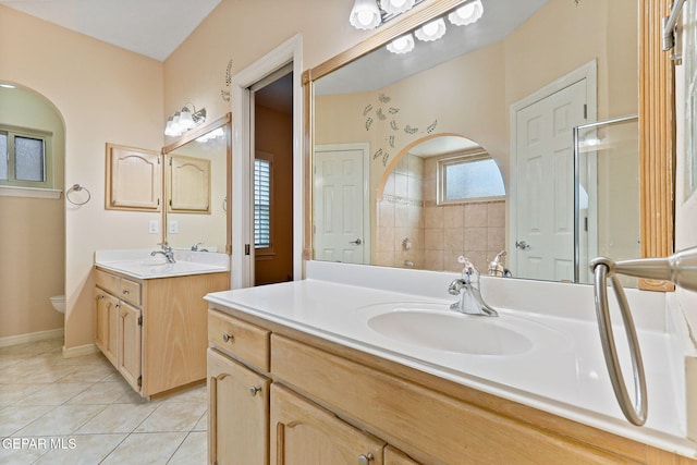 7008 Desert Canyon Dr, El Paso, TX 79912 - bathroom with two vanities, tile patterned flooring, and toilet