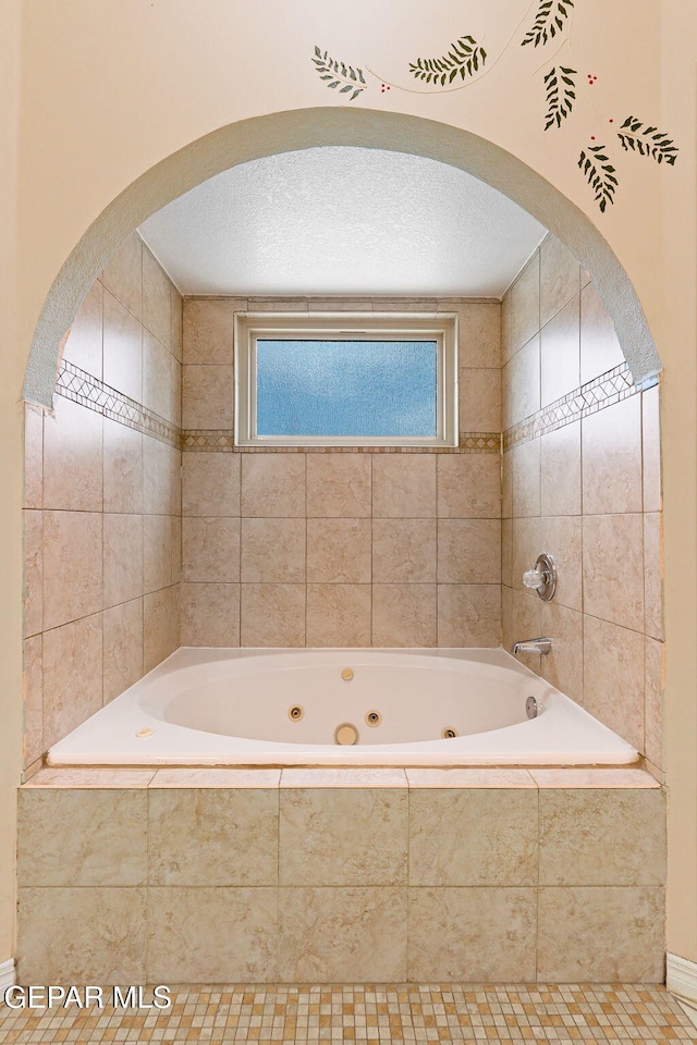 7008 Desert Canyon Dr, El Paso, TX 79912 - full bathroom with a jetted tub and tile patterned flooring