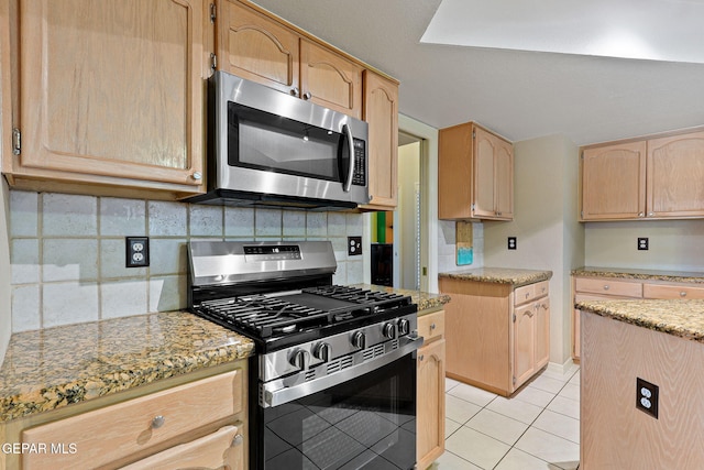 7008 Desert Canyon Dr, El Paso, TX 79912 - kitchen with stainless steel appliances, light brown cabinets, tasteful backsplash, light tile patterned flooring, and light stone counters