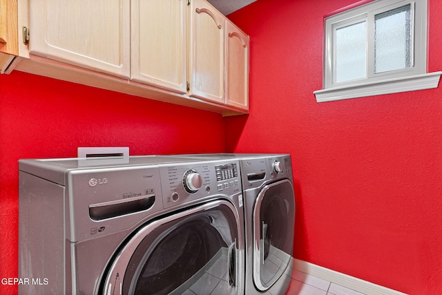 7008 Desert Canyon Dr, El Paso, TX 79912 - clothes washing area with cabinet space, washer and dryer, tile patterned flooring, and baseboards