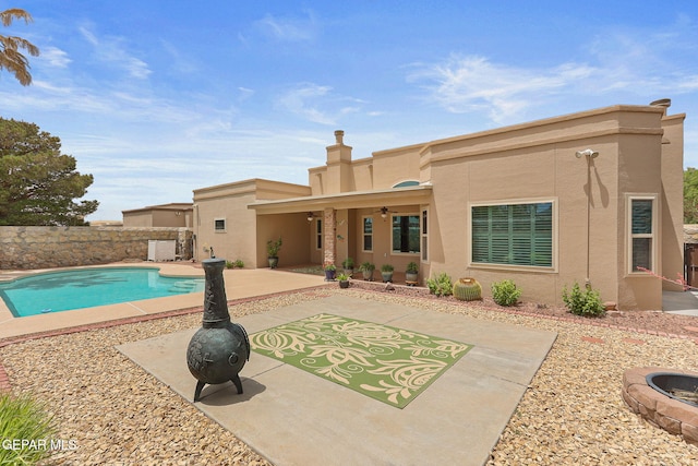 7008 Desert Canyon Dr, El Paso, TX 79912 - view of swimming pool featuring a patio area, a fenced backyard, and an outdoor fire pit