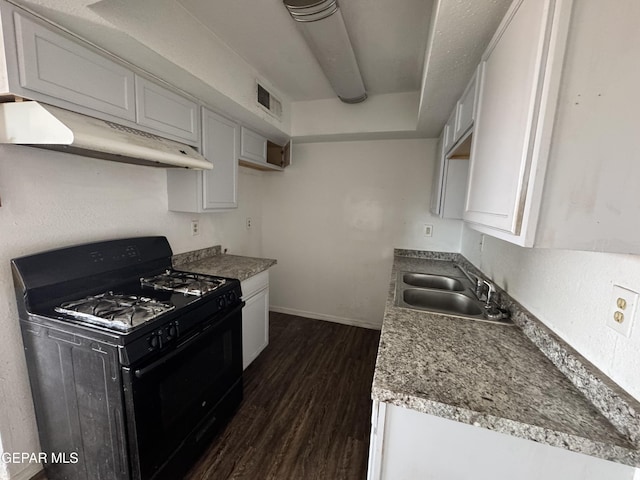 10620 Cuatro Vistas Dr Unit A, El Paso, TX 79935 - kitchen featuring black gas stove, under cabinet range hood, a sink, dark wood finished floors, and baseboards