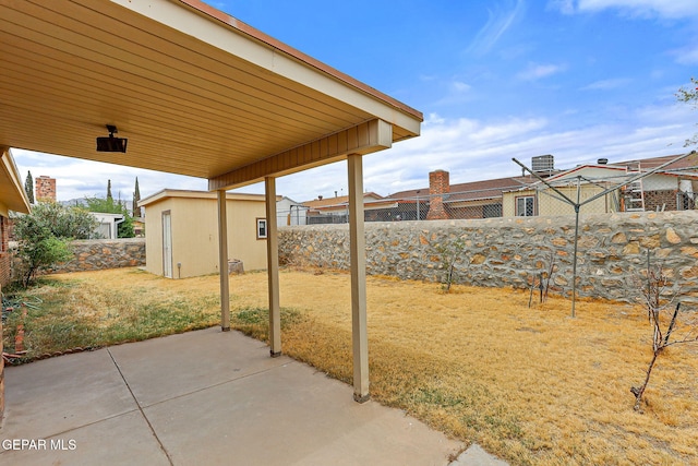 view of patio featuring an outdoor structure and cooling unit