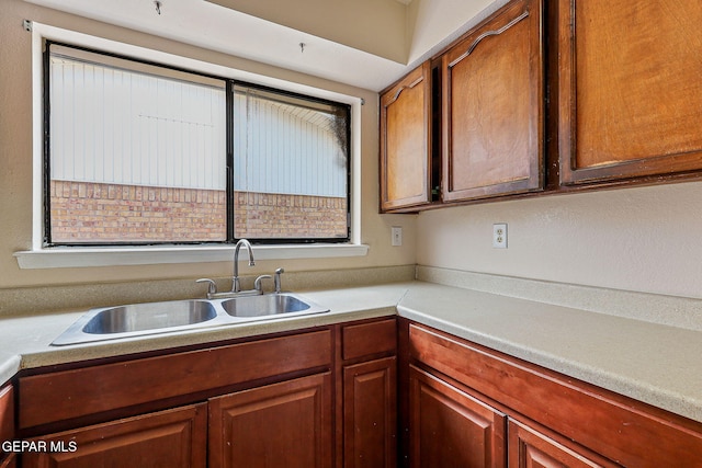 kitchen with a sink and light countertops