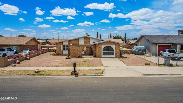 8520 Paddlefoot Ln, El Paso, TX 79907 - view of front facade with brick siding and driveway