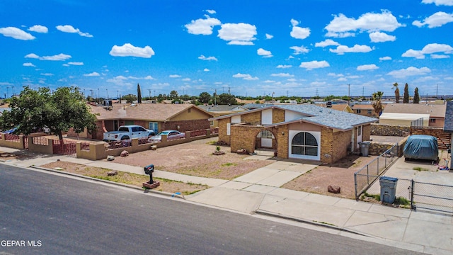 8520 Paddlefoot Ln, El Paso, TX 79907 - view of front of property with a gate and brick siding