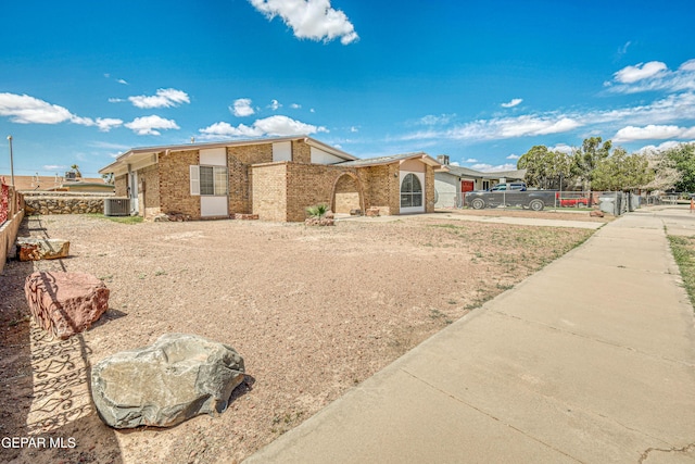 8520 Paddlefoot Ln, El Paso, TX 79907 - view of front of house featuring central AC unit and brick siding