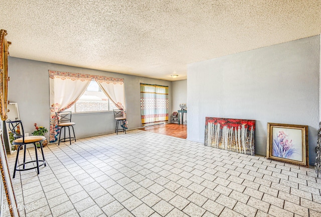 8520 Paddlefoot Ln, El Paso, TX 79907 - living area featuring a textured ceiling