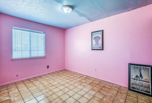 8520 Paddlefoot Ln, El Paso, TX 79907 - empty room featuring a textured ceiling