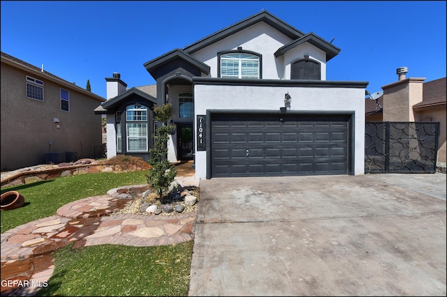 ranch-style house with stucco siding, driveway, a garage, and central air condition unit