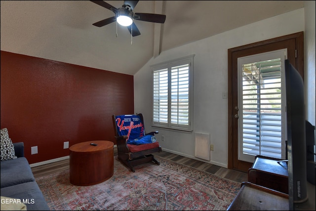 sitting room with wood finished floors, ceiling fan, and baseboards