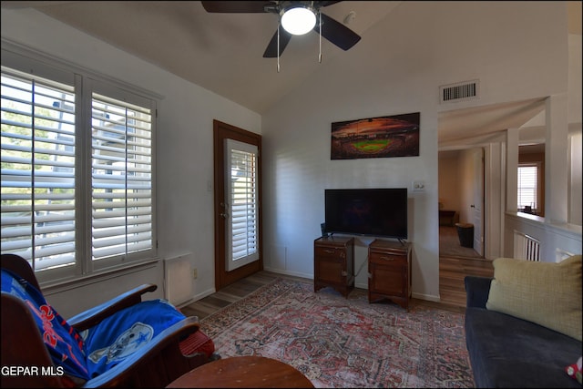 living room featuring light wood-style floors, ceiling fan, and high vaulted ceiling